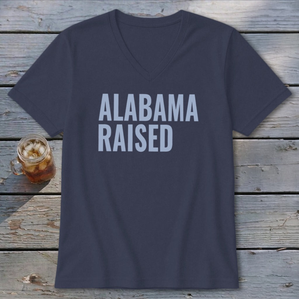 Dark blue v-neck t-shirt with "ALABAMA RAISED" in light blue text.