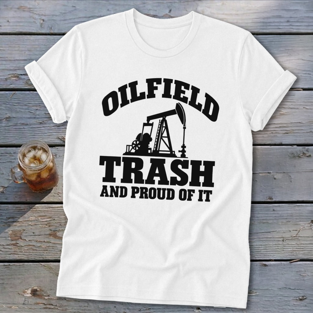 White t-shirt with black graphic of oil derrick and text "OILFIELD TRASH AND PROUD OF IT".