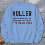 Light blue sweatshirt with text: "HOLLER NOT JUST WHERE YOU LIVE BUT HOW YOU CALL SOMEONE FIVE RIDGES OVER"