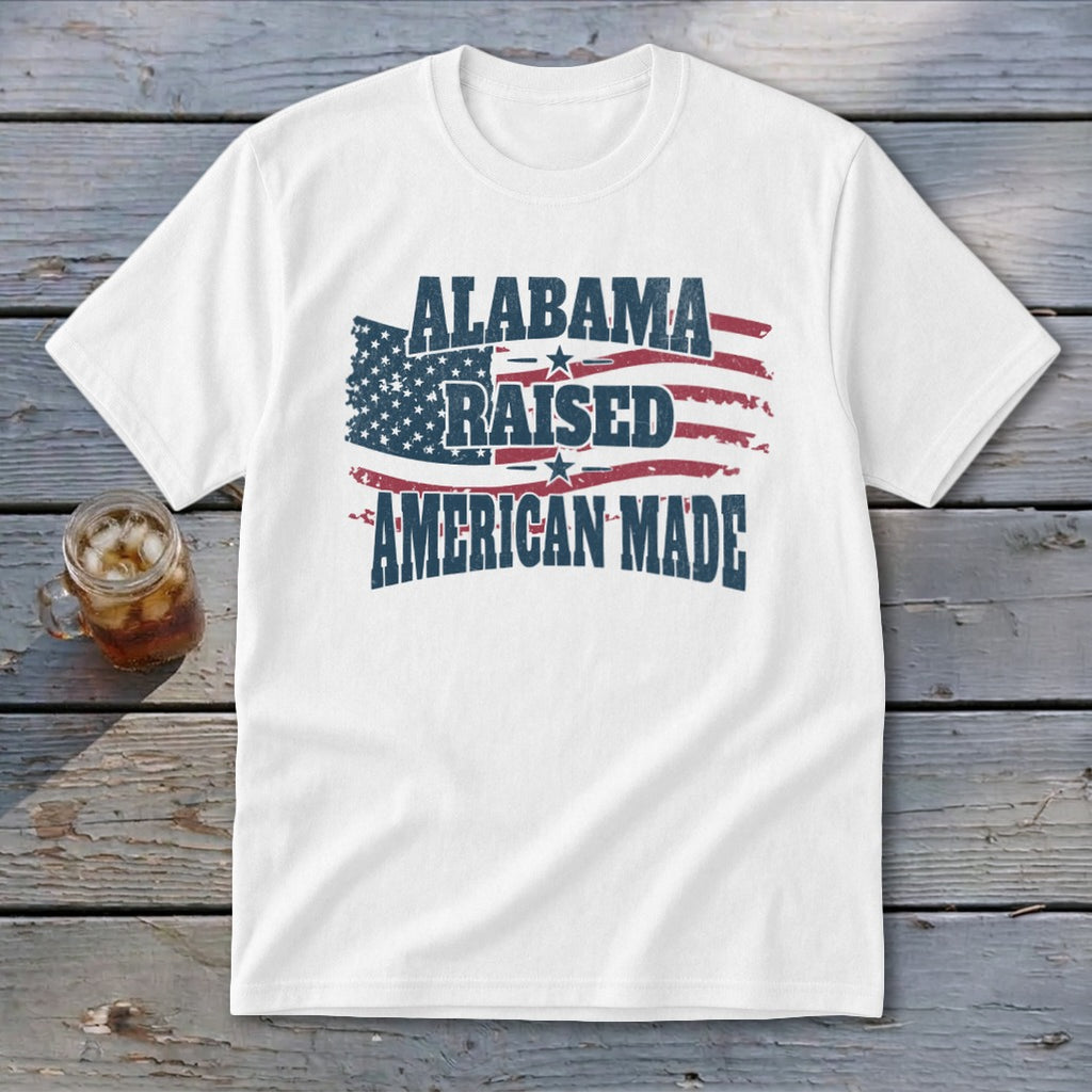 White t-shirt with distressed American flag and text "Alabama Raised American Made".