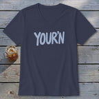 Dark blue v-neck t-shirt with light blue "YOUR'N" text and a glass of iced tea.