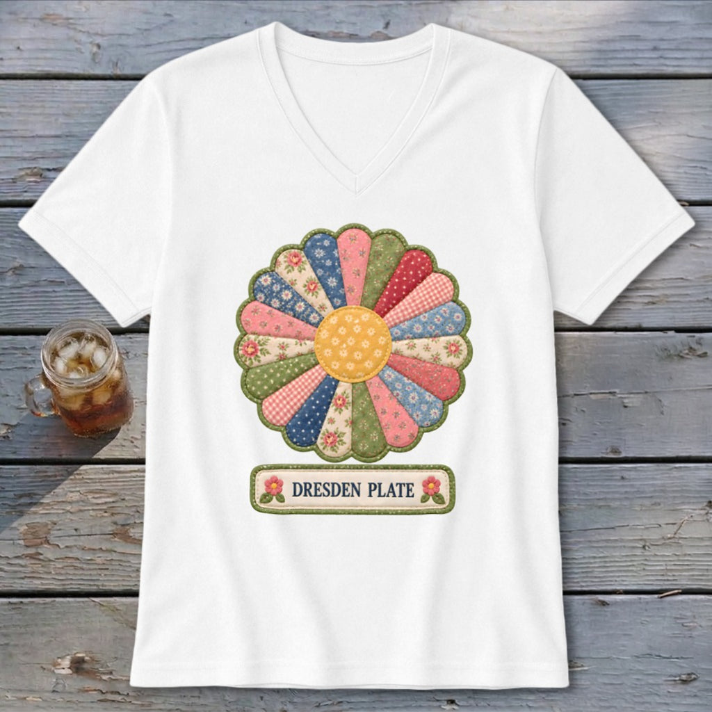 White v-neck t-shirt with a colorful Dresden Plate quilt design and text.