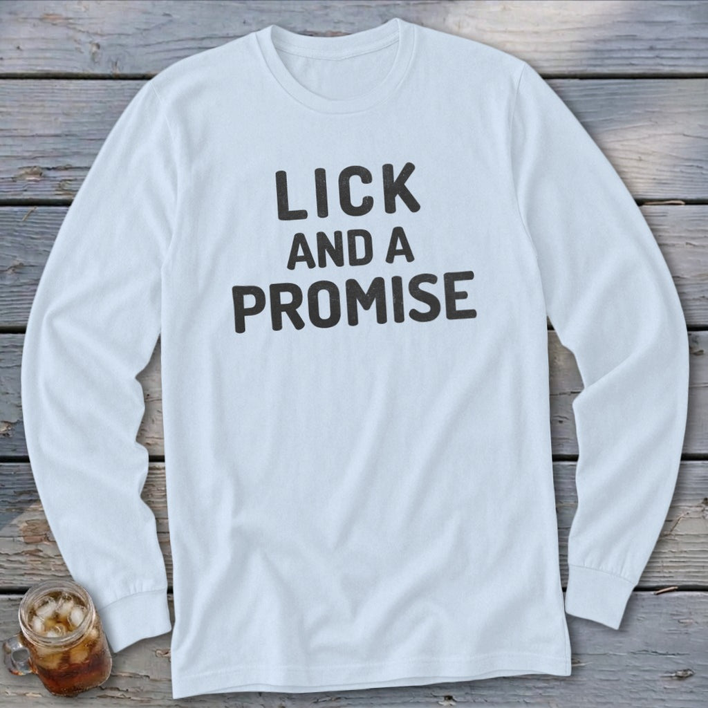 White long-sleeve shirt with "LICK AND A PROMISE" printed in dark gray text.