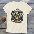 Cream t-shirt with "Always Leave the Light On COME ON IN" text and a lantern graphic.