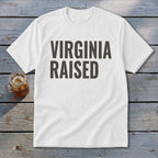 White t-shirt with dark gray text that reads "VIRGINIA RAISED"