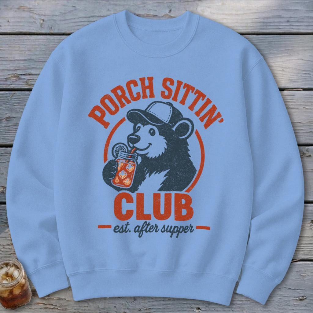 Light blue sweatshirt with a bear drinking from a jar and "Porch Sittin' Club" text.
