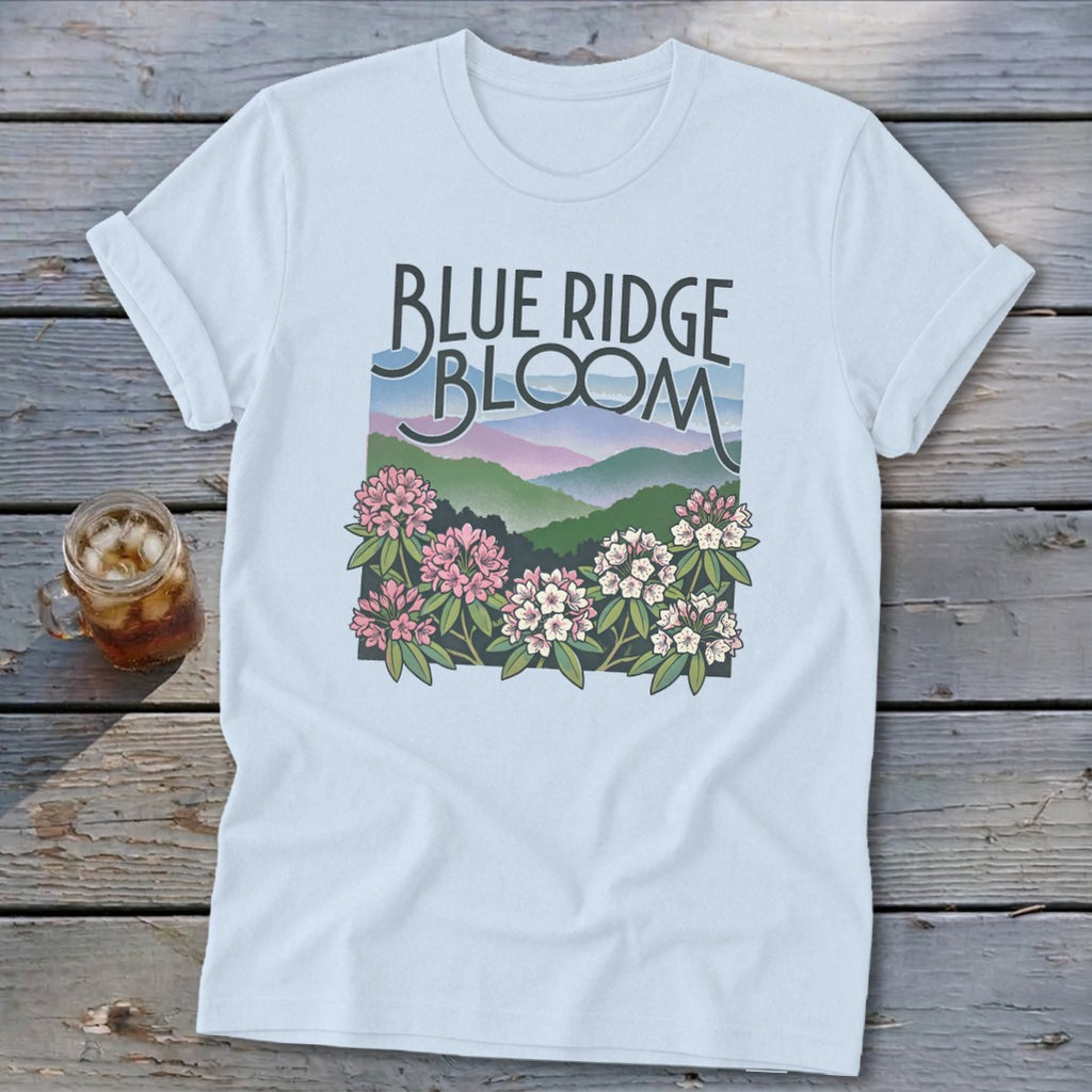 Light blue t-shirt with "Blue Ridge Bloom" text and mountain and flower graphic.