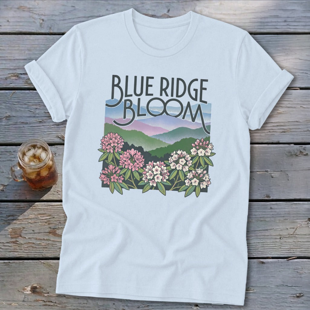 Light blue t-shirt with "Blue Ridge Bloom" text and mountain and flower graphic.