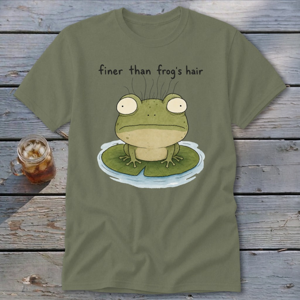 An olive green t-shirt featuring an illustration of a wide-eyed frog on a lily pad with the text "finer than frog's hair."
