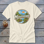 Cream t-shirt with circular graphic of Mississippi landscape, river, and deer.