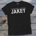 Black t-shirt with white text "LOOKING A LITTLE JAKEY".