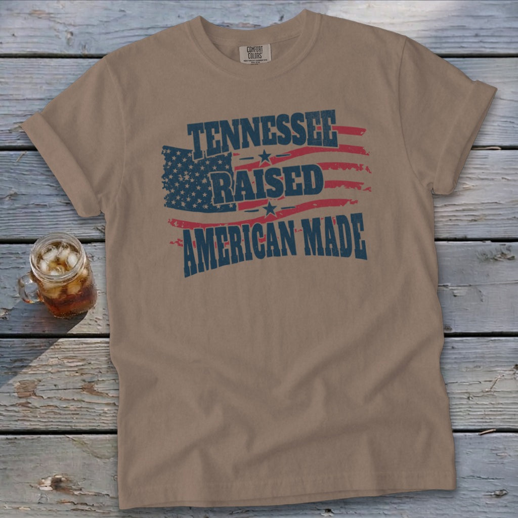 Tan t-shirt with "Tennessee Raised American Made" and distressed US flag.
