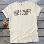 Cream t-shirt with black text reading "JUST A MESSIN AND A GOMMIN".