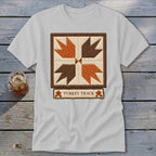 White t-shirt with a "Turkey Track" quilt block design and text.
