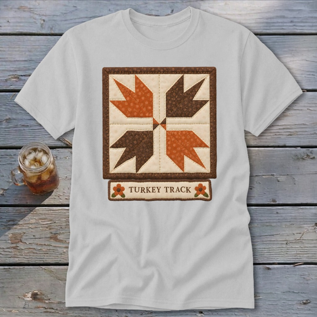 White t-shirt with a "Turkey Track" quilt block design and text.