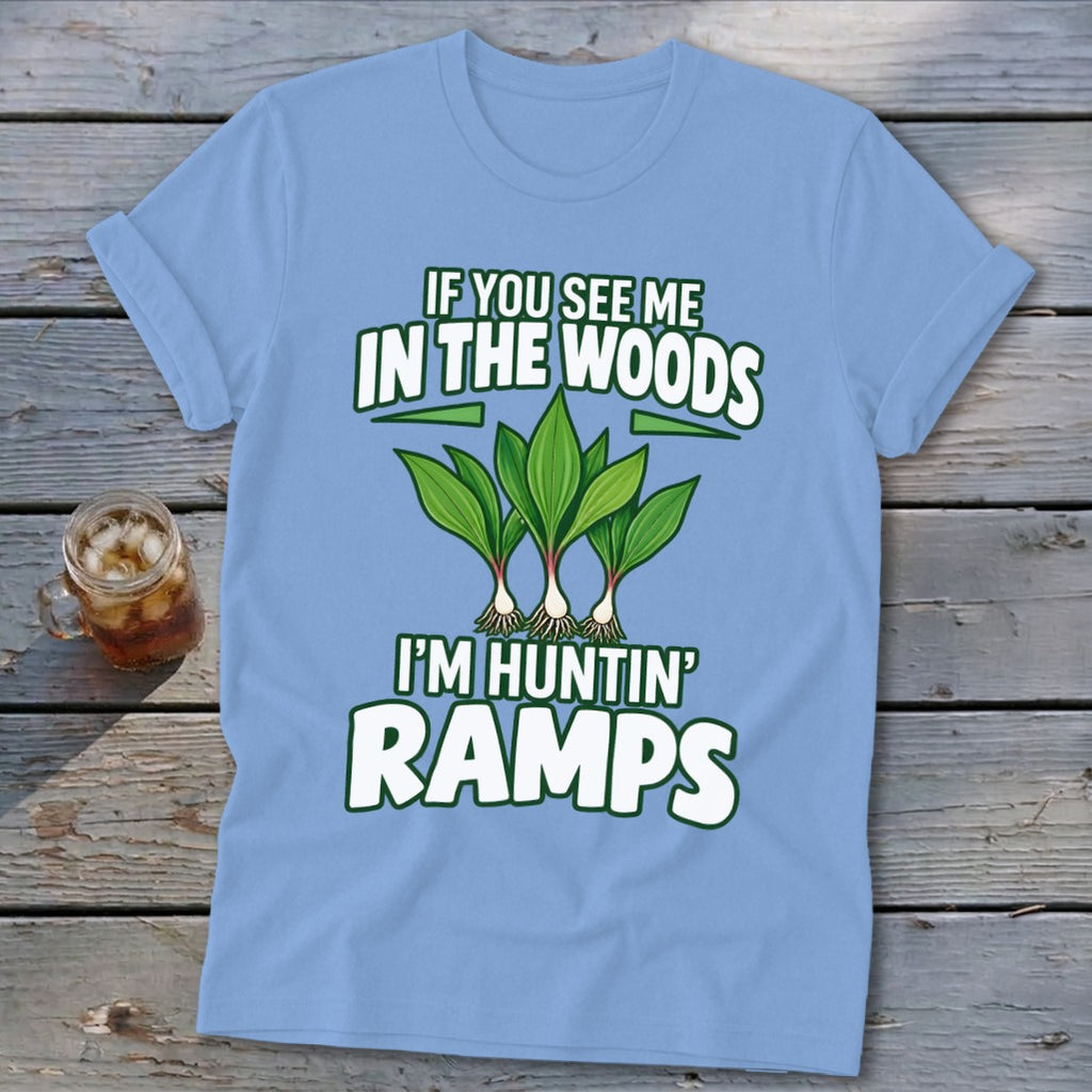 A light blue t-shirt printed with the text IF YOU SEE ME IN THE WOODS I'M HUNTIN RAMPS above a graphic of ramps.