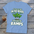 A light blue t-shirt printed with the text IF YOU SEE ME IN THE WOODS I'M HUNTIN RAMPS above a graphic of ramps.