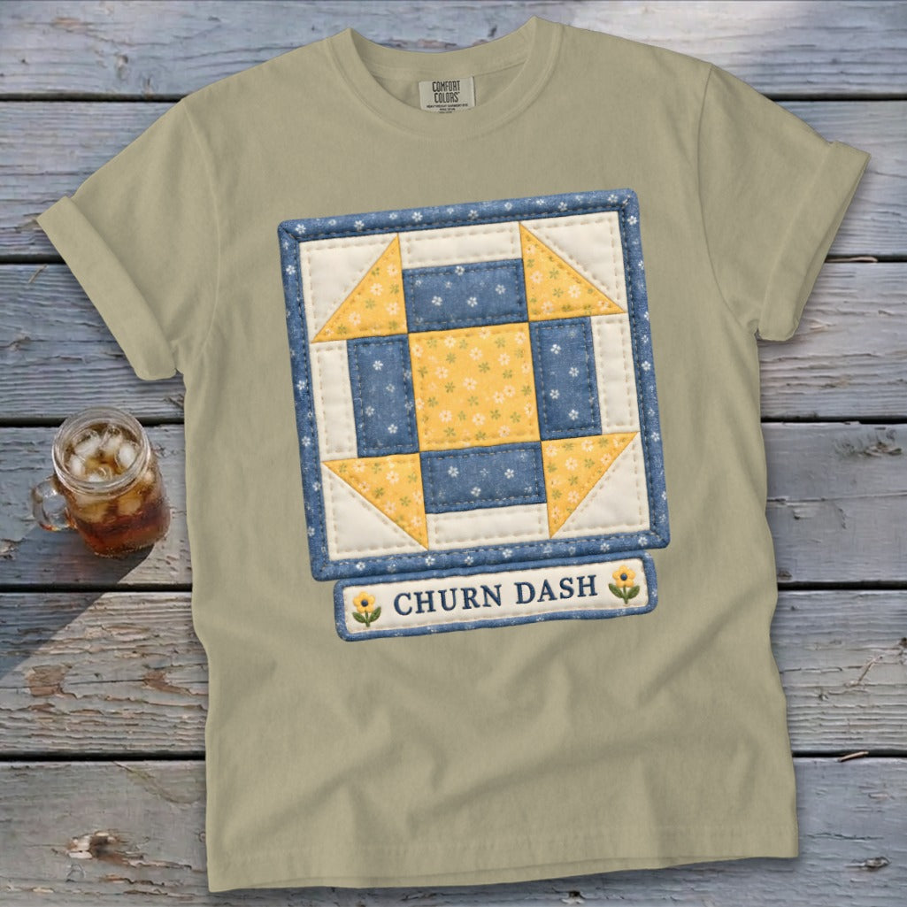Tan t-shirt with a quilted block design and "CHURN DASH" text.