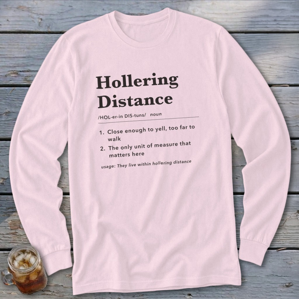 Pink long-sleeve shirt with "Hollering Distance" definition printed in black text.