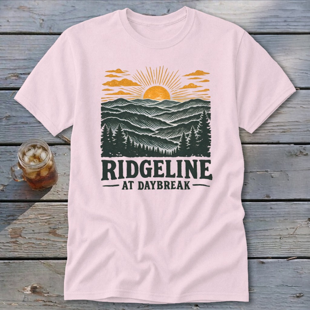 Pink t-shirt with "RIDGELINE AT DAYBREAK" text and mountain sunset graphic.