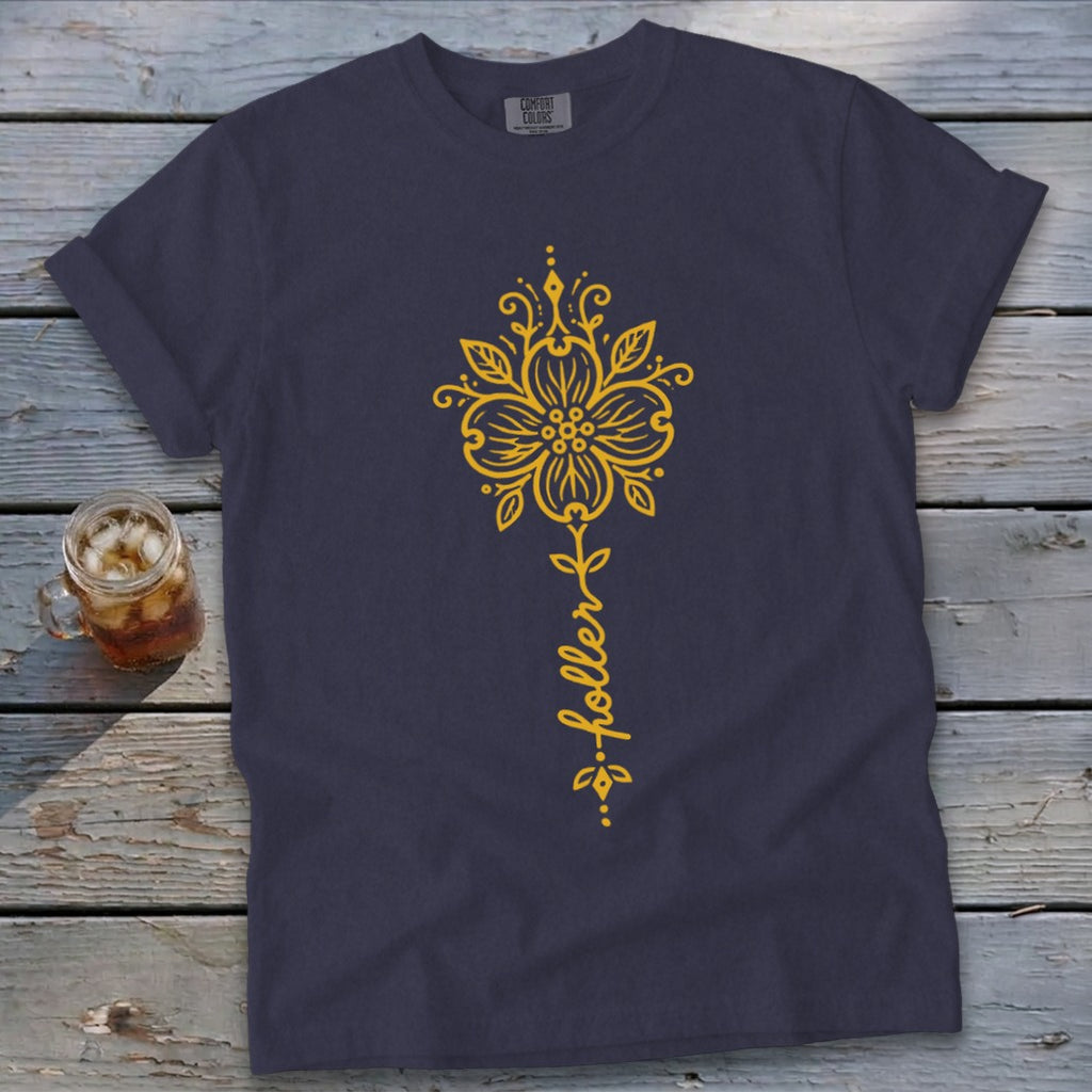 Dark blue t-shirt with yellow flower and "holler" text graphic.