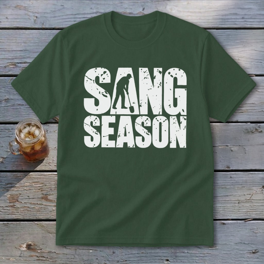 Dark green short-sleeve t-shirt with distressed white text reading SANG SEASON and a graphic of a person digging.