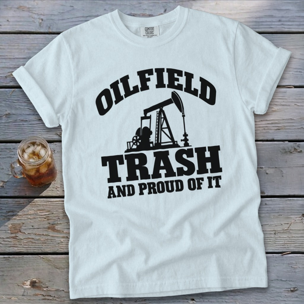 White t-shirt with black graphic: "Oilfield Trash And Proud Of It" and pumpjack illustration.