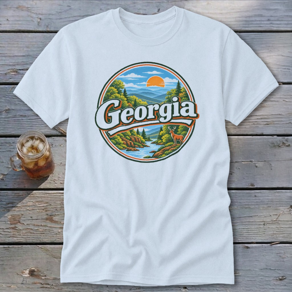 White t-shirt with a circular graphic featuring mountains, river, deer, and the word "Georgia".