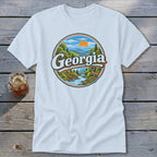 White t-shirt with a circular graphic featuring mountains, river, deer, and the word "Georgia".