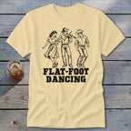 T-shirt with black line art of three people dancing and the words "FLAT-FOOT DANCING."