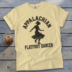 Light yellow t-shirt featuring a black silhouette of a dancer and the text Appalachian Flatfoot Dancer.
