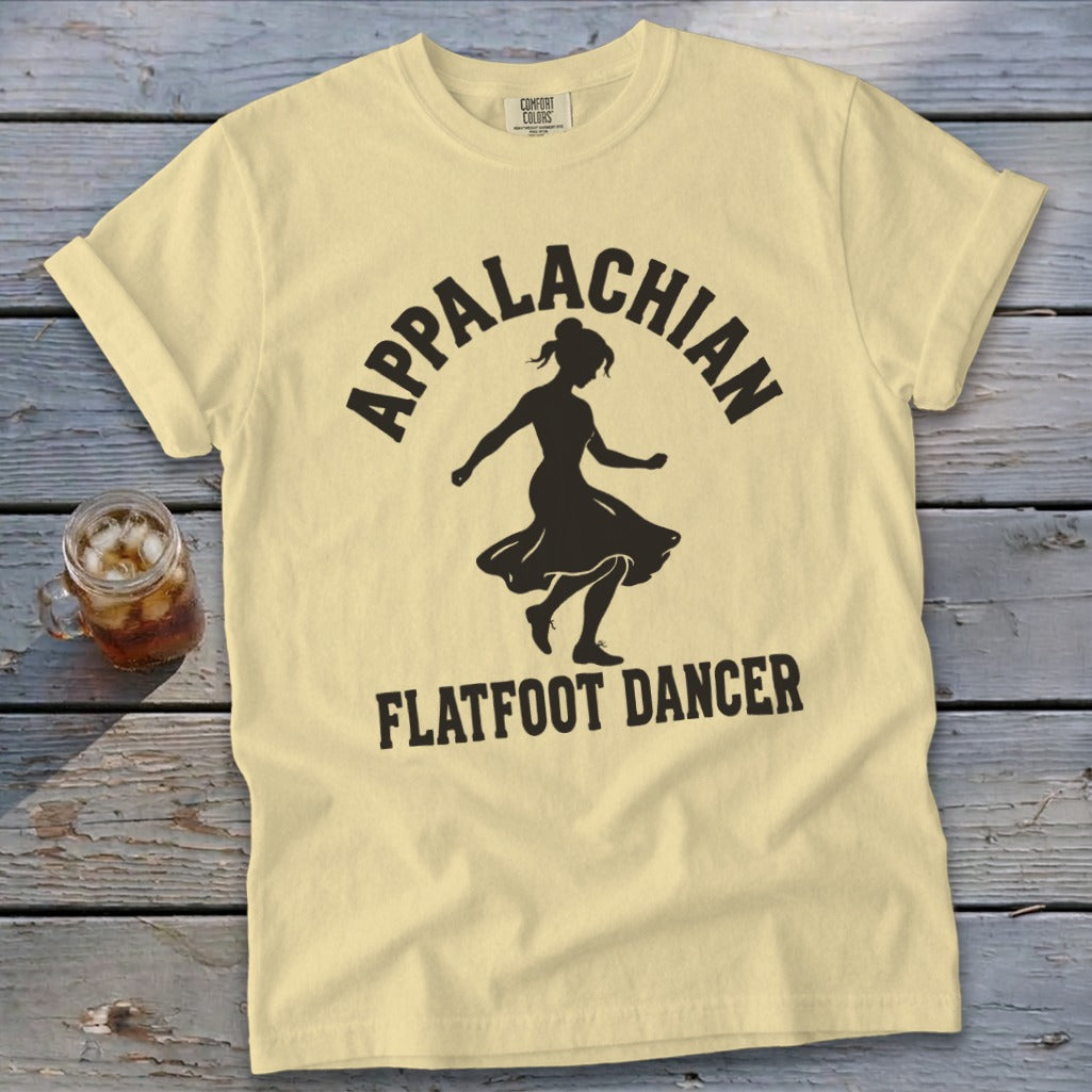 Light yellow t-shirt featuring a black silhouette of a dancer and the text Appalachian Flatfoot Dancer.