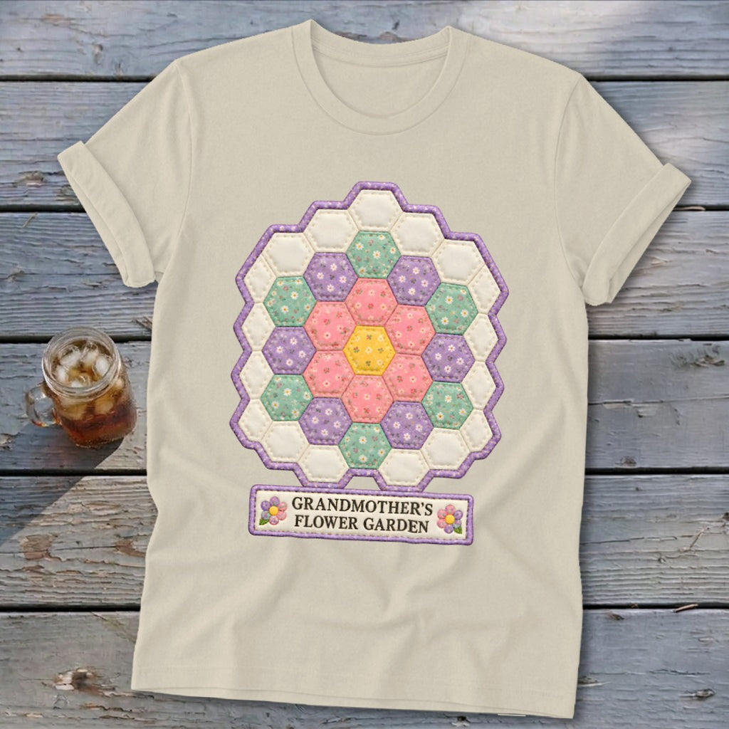 Light tan t-shirt with a hexagonal flower garden quilt design and text.