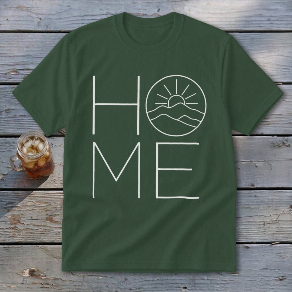 Dark green t-shirt with white graphic text spelling "HOME," featuring mountains and a sun.