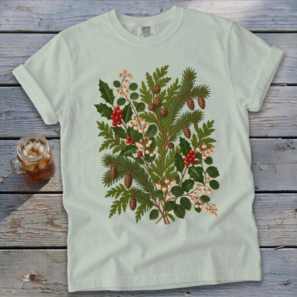 Light green t-shirt with a green pine and holly botanical print.