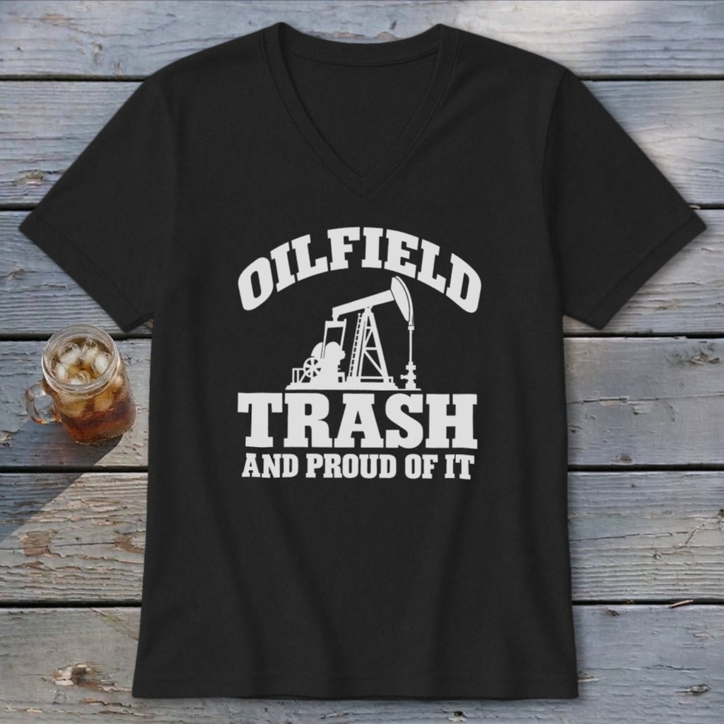 A black V-neck t-shirt featuring a white graphic of an oil pump jack with text reading OILFIELD TRASH AND PROUD OF IT.