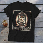 Black t-shirt with a vintage lantern and "BUILT TO LAST" text graphic.