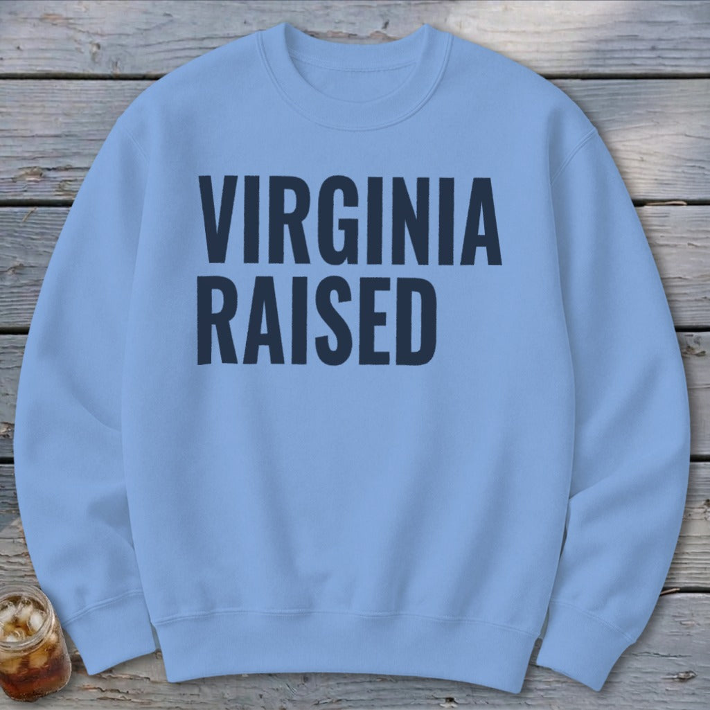 Light blue sweatshirt with "VIRGINIA RAISED" printed in dark blue on the front.