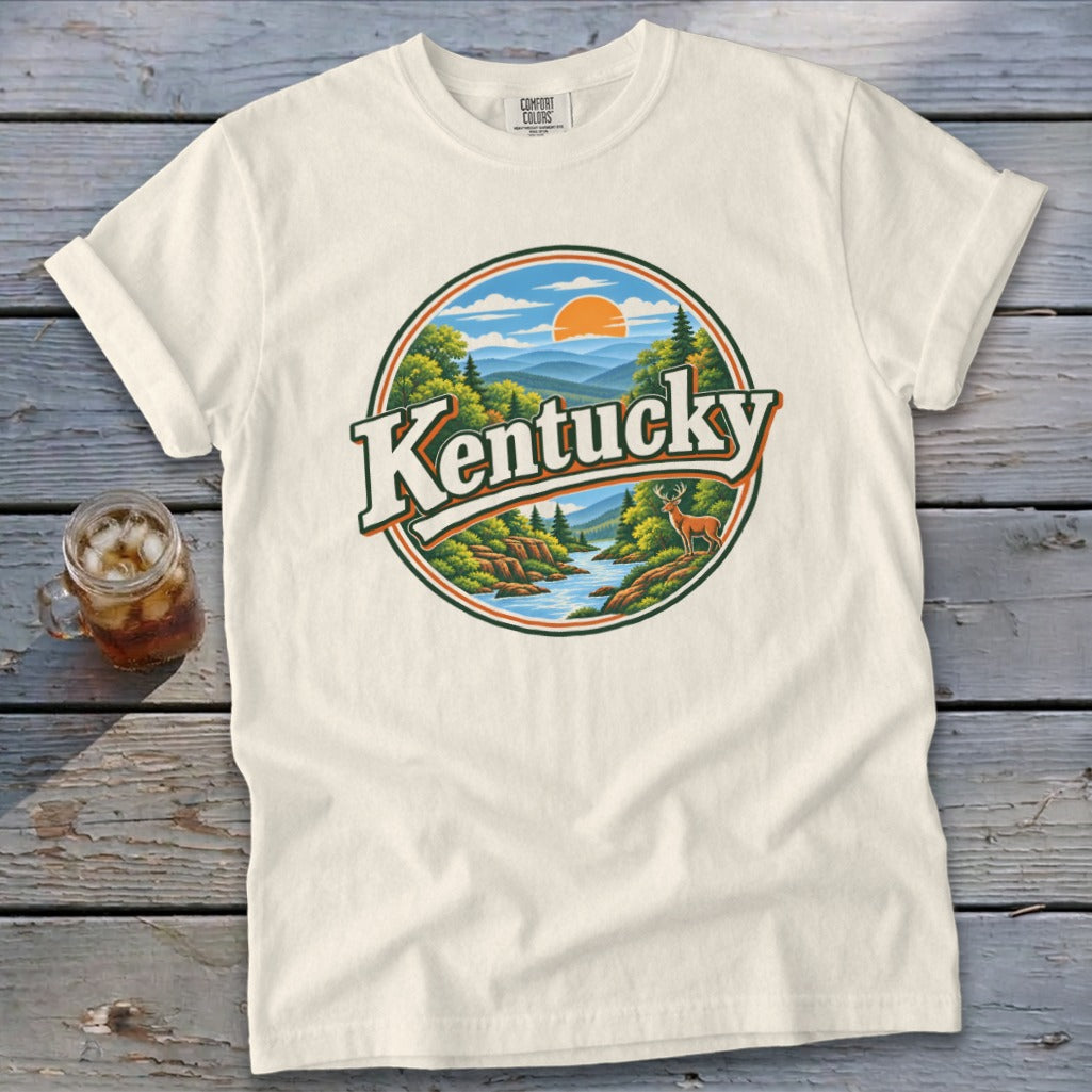Cream t-shirt with circular graphic of Kentucky landscape with deer and river.