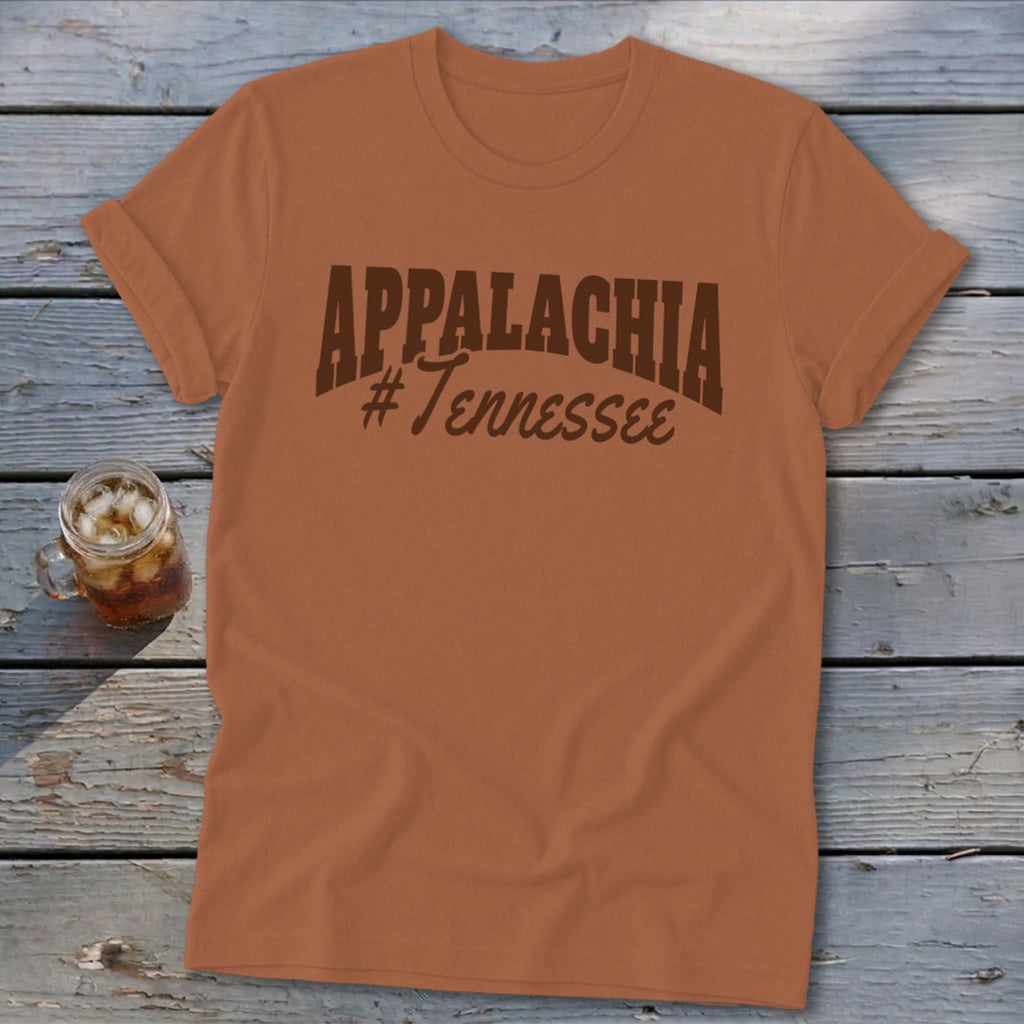 Orange t-shirt with "APPALACHIA #Tennessee" text, next to a glass of iced tea.