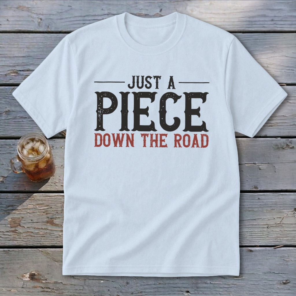 White t-shirt with "Just a Piece Down the Road" text in distressed black and red.