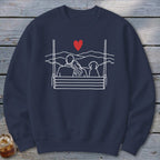 Navy sweatshirt with white line drawing of couple and dog on a swing overlooking mountains and a heart.