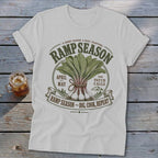 T-shirt with "Ramp Season" graphic featuring ramps, April, May, and "Dig, Cook, Repeat."