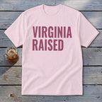Light pink t-shirt with "Virginia Raised" text in dark pink.