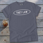 Grey t-shirt with white oval design saying "THEY LAW".