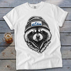 White t-shirt with a black and white graphic of a raccoon wearing a beanie with mountains.