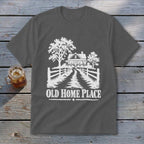 Graphic of a farmhouse and trees with "OLD HOME PLACE" text.