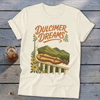 Cream t-shirt with "Dulcimer Dreams" text and dulcimer on a porch railing.