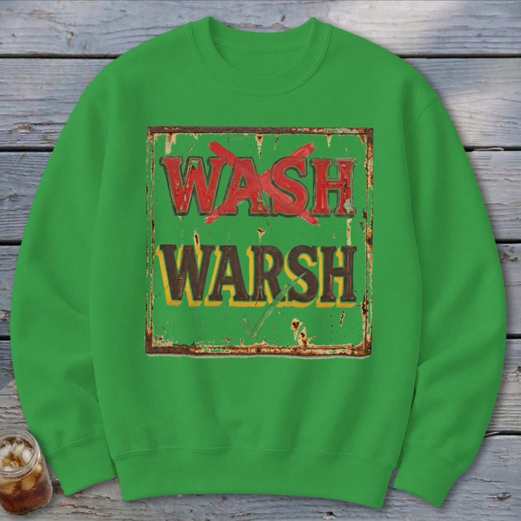 A bright green crewneck sweatshirt featuring a graphic of a rusted, green sign with the words "WASH" crossed out in red and "WARSH" checked in green.
