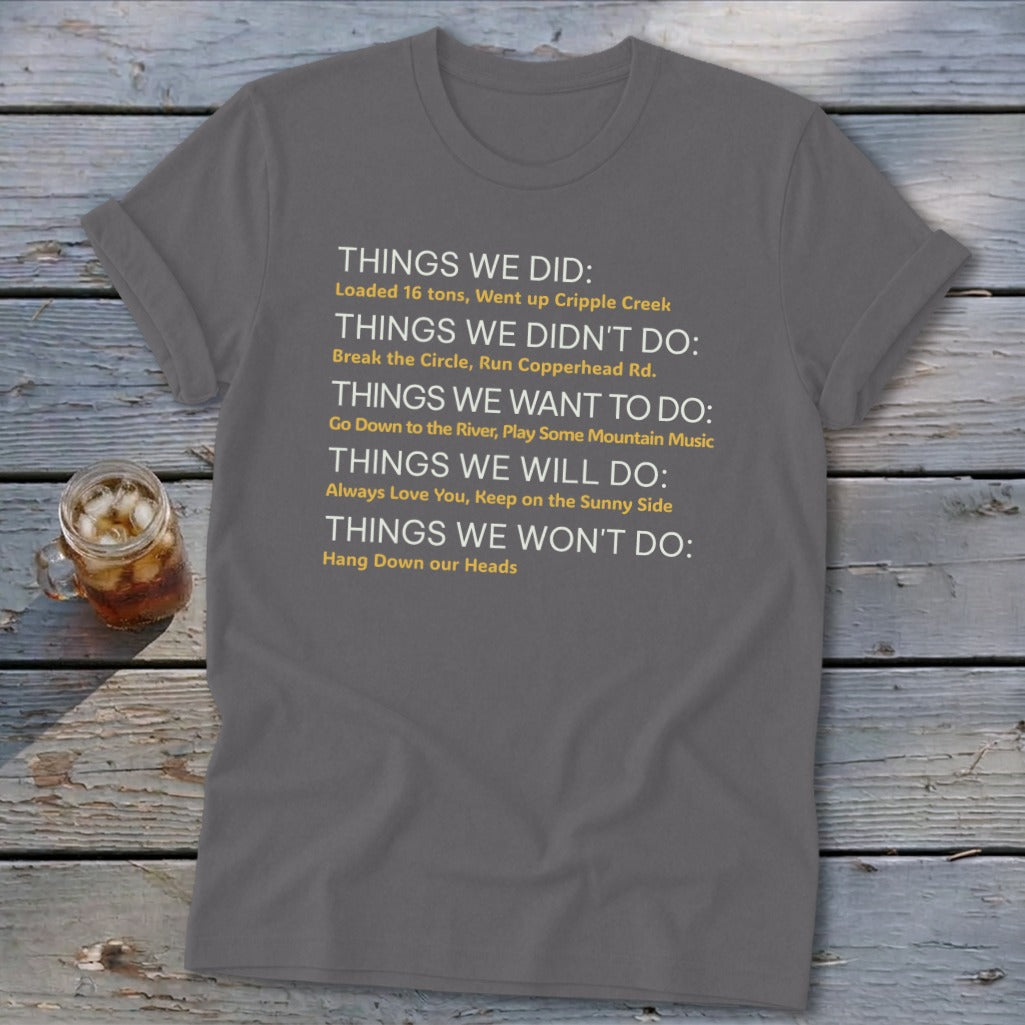 Gray t-shirt with text listing things done, not done, want to do, will do, and won't do.